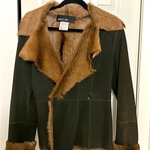 Stunning fur and suede designer coat.  Fits like a 6 or 8.